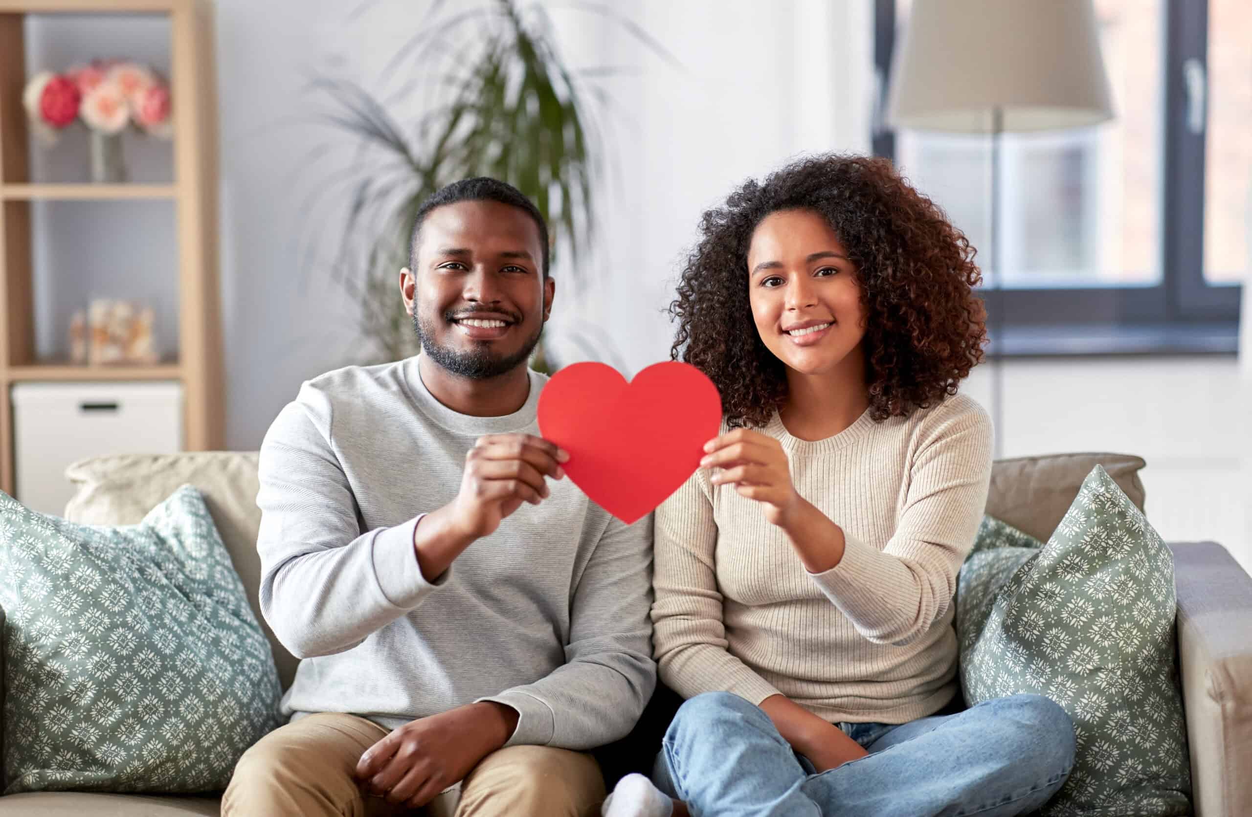 A happy couple smiles for Valentine's Day.